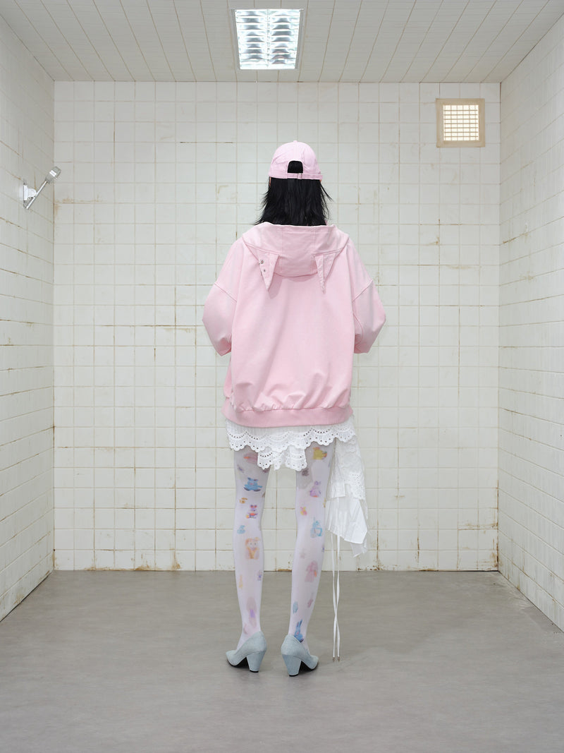 Back view of model wearing pink zip hoodie with hood down