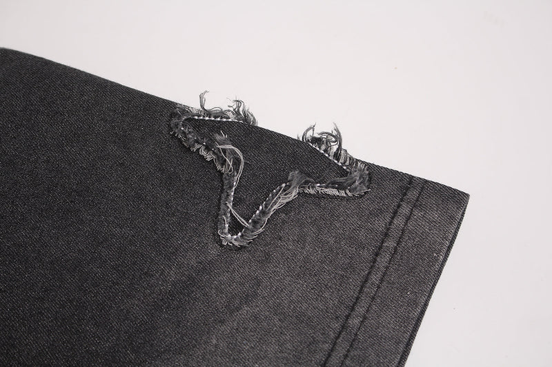 Black vintage washed T-shirt sleeve with distressed star patch detail and frayed stitched edges