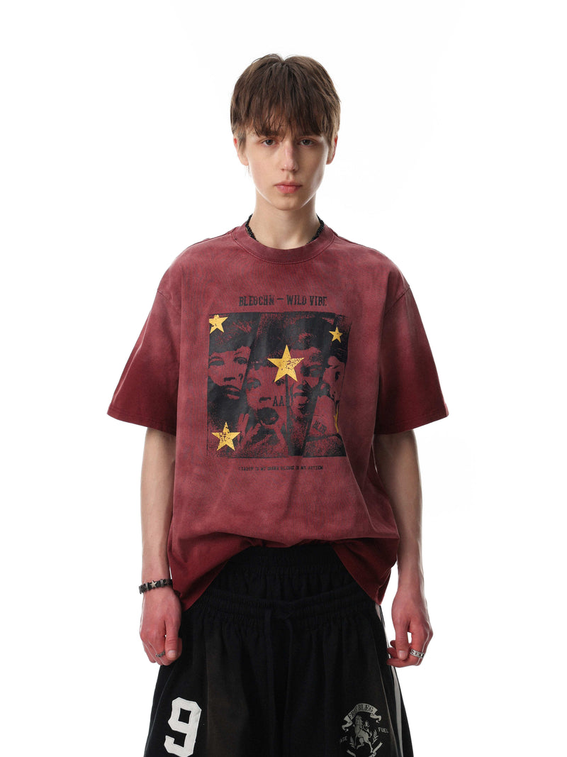 Maroon vintage washed graphic T-shirt with star print on a model, styled as a relaxed streetwear tee