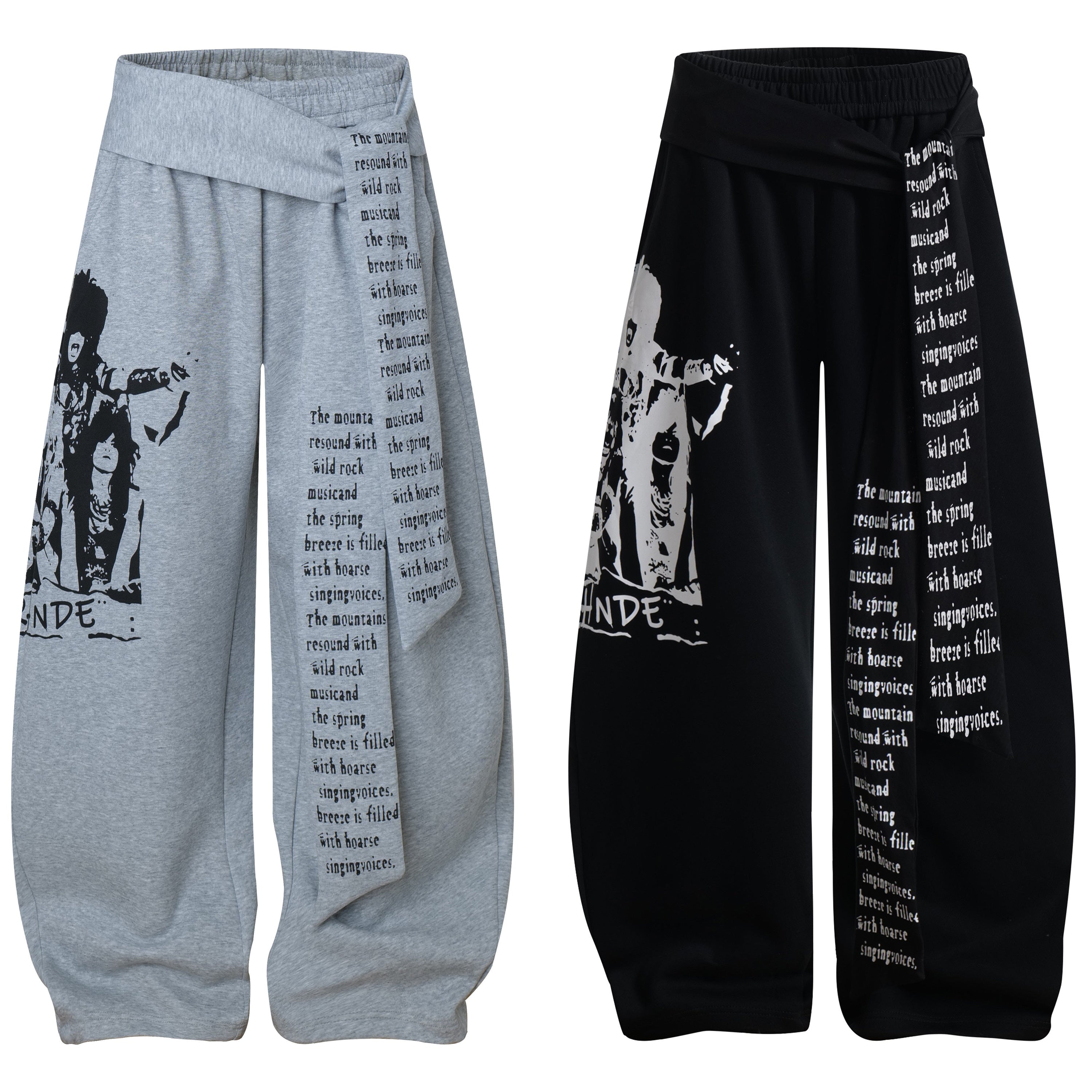 Heather grey wide-leg wrap pants with rock band graphic print and asymmetric text drape panel, front view