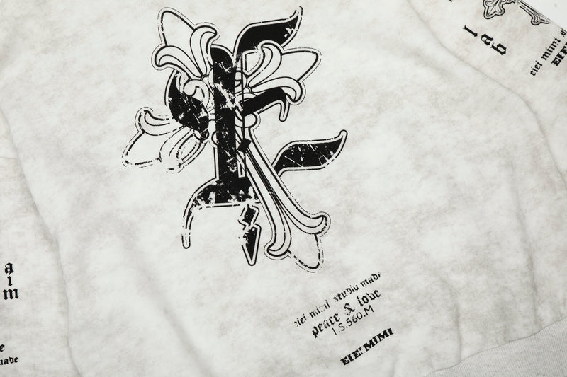 Close-up of front chest graphic on white hoodie with black gothic lettering and cross design