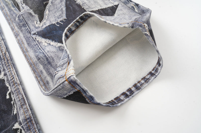 Close-up of the hem on patchwork jeans with rolled cuff and light denim lining