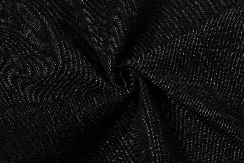 Close-up of black denim fabric texture and drape