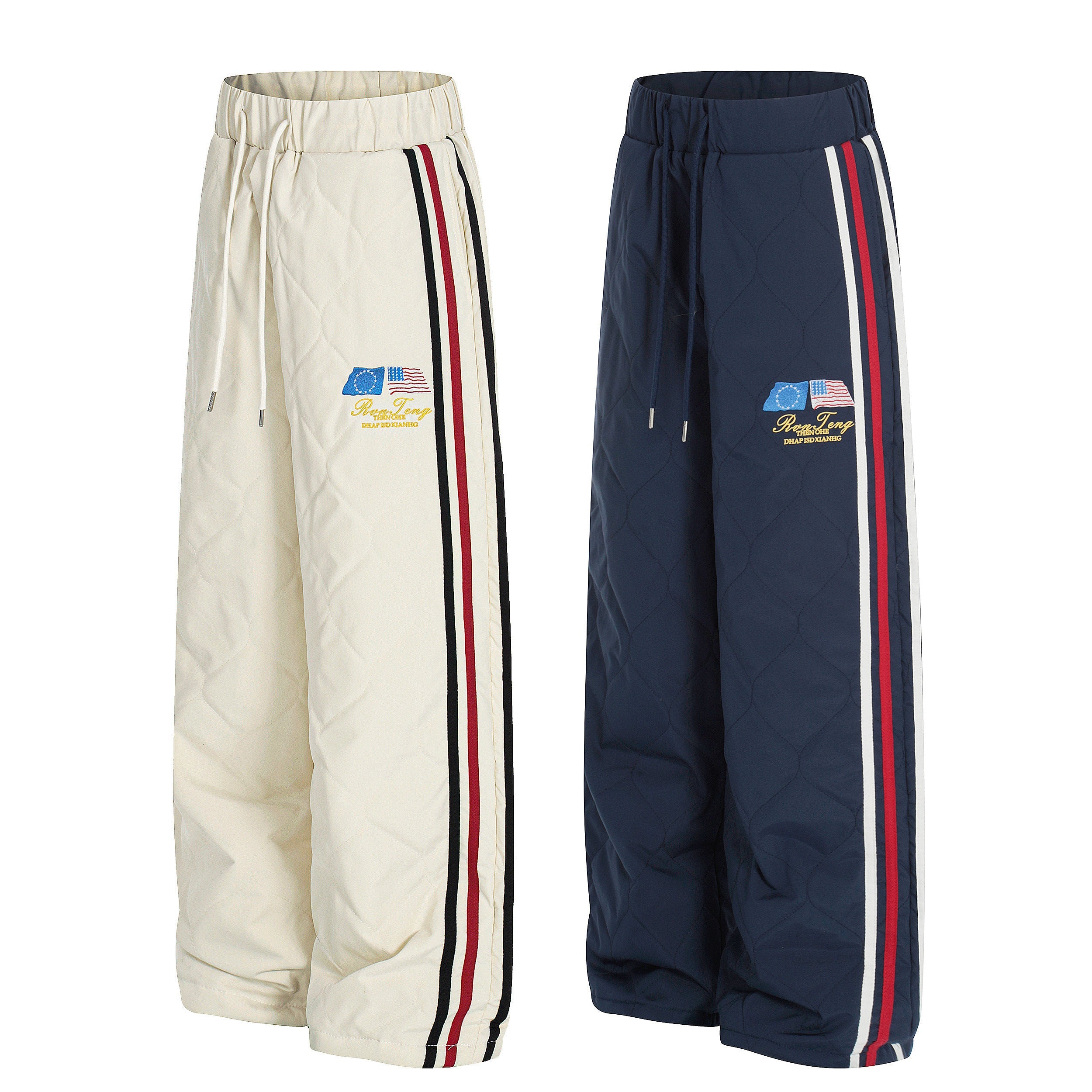 Cream and navy quilted wide-leg track pants with red and black side racing stripes and embroidered patch detail