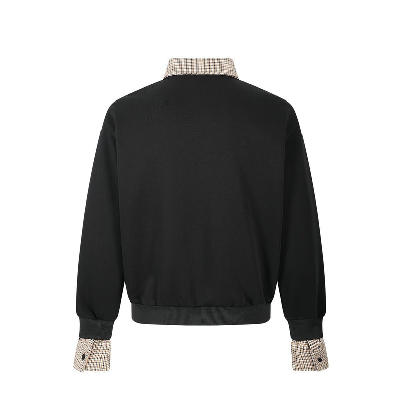 Back view of black pullover with beige plaid collar and cuff trim