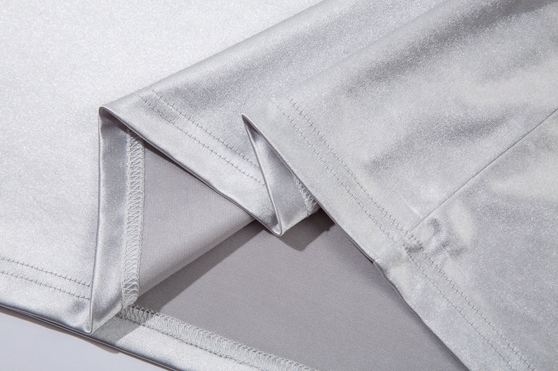 Close-up of white jersey tee sleeve hem and side seam detail