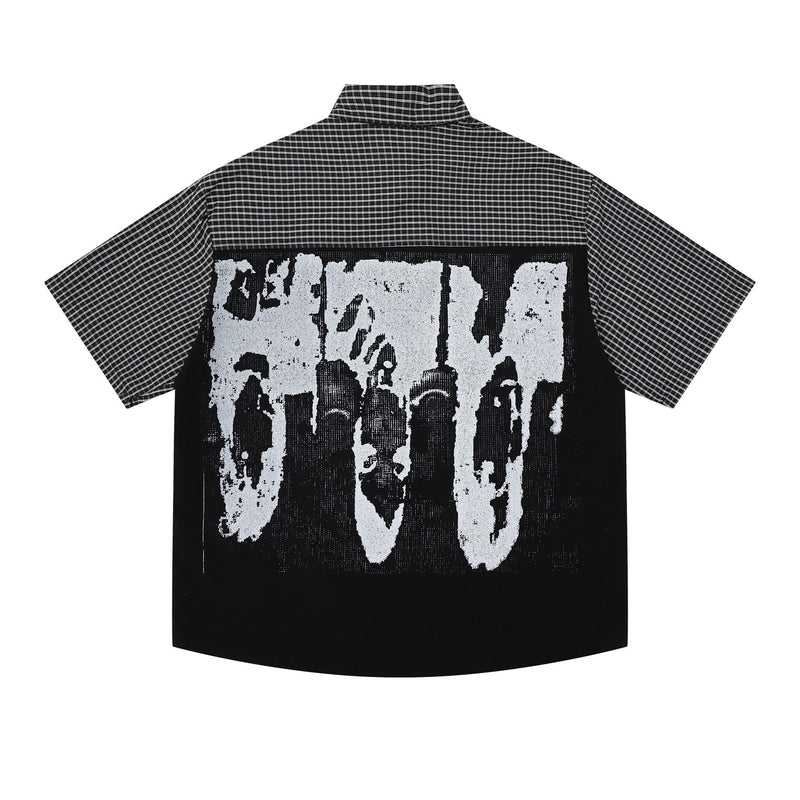 Black and white plaid button-up shirt with oversized graphic print on the back, short sleeves, and streetwear style