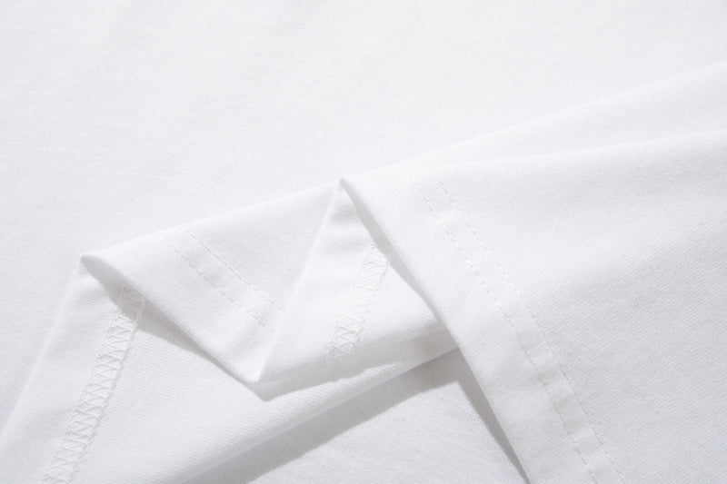 White ringer T-shirt sleeve with double-stitched hem and soft cotton fabric close-up