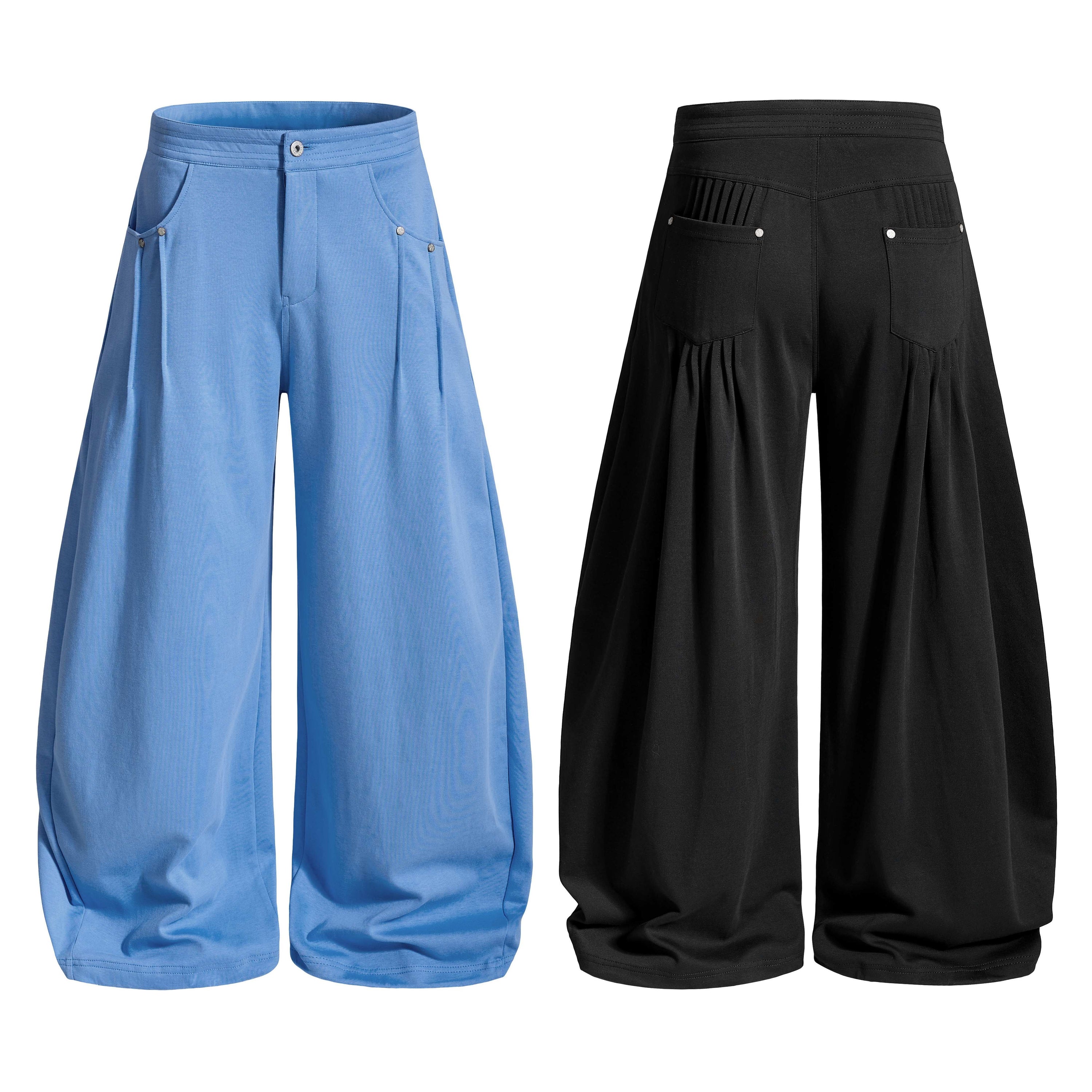 Omirad Flow Wide-Leg Pants in blue showing front view with wide draped silhouette, structured waistband and front pockets