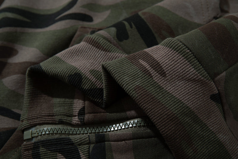 Close-up of ribbed cuff and zipper area on camouflage hoodie