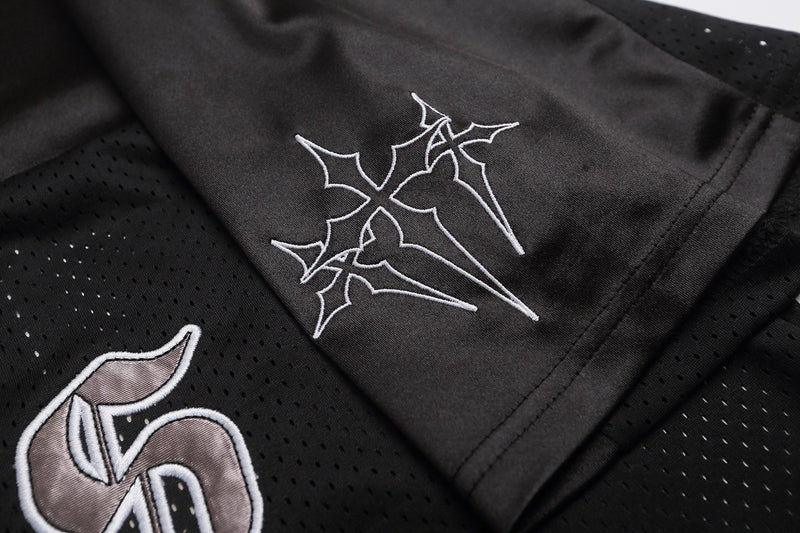 Black mesh football jersey with gothic white embroidery and streetwear-inspired detailing on the sleeve