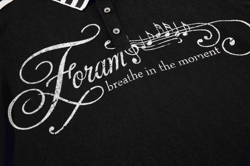 Black polo shirt with white music script print and vintage-style lettering on the chest
