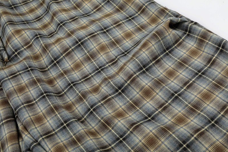 Close-up of plaid fabric texture on lounge shorts