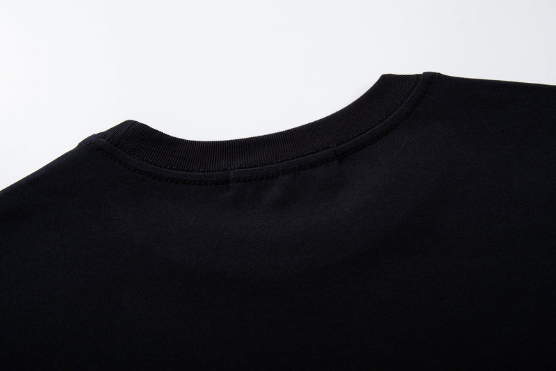 Black vintage graphic T-shirt with ribbed crew neckline, shown in close-up against a clean white background