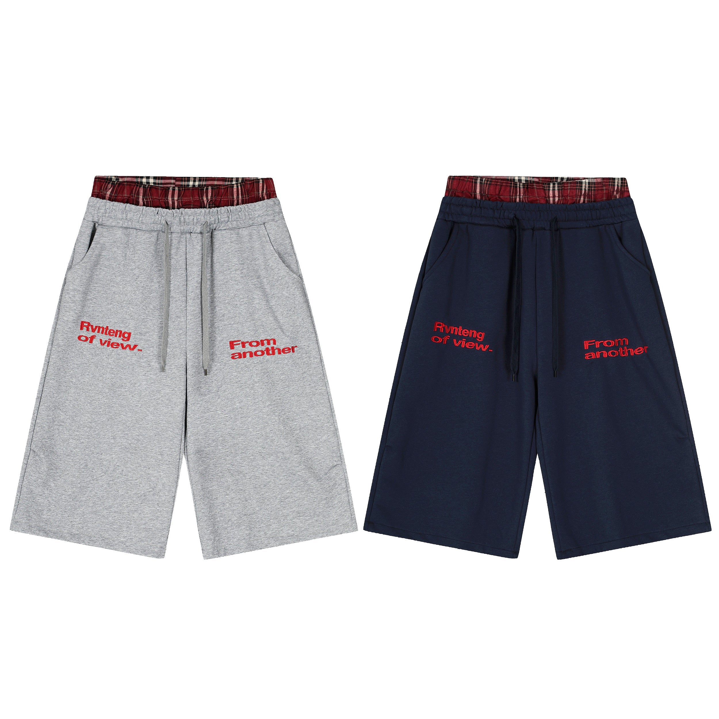Navy and grey wide-leg shorts with red plaid waistband and red embroidered logo text on front