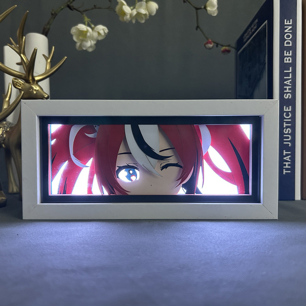 The Seakoff Anime Light Box, a premium 3D dynamic color-changing LED lamp, features a red and white-haired, winking anime character. It&