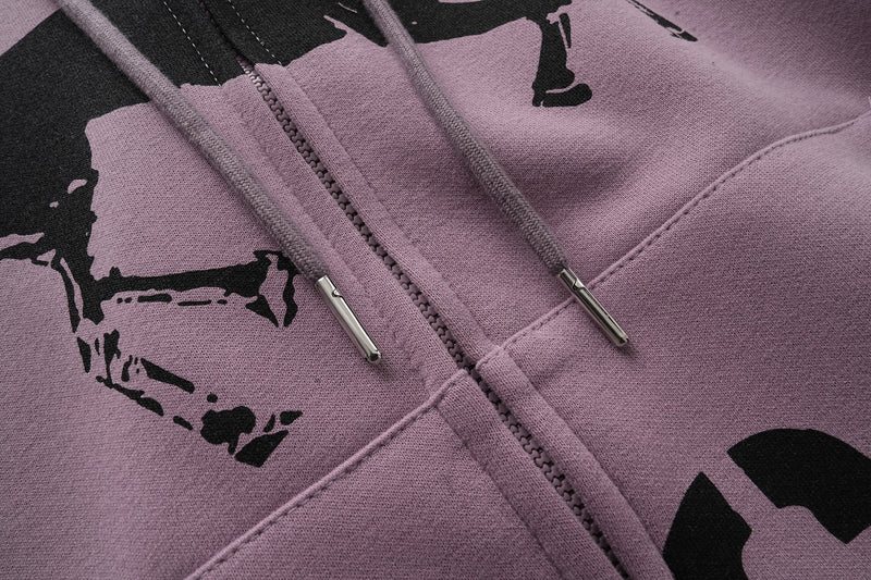 Close-up of lavender hoodie chest print, drawstrings, and zipper