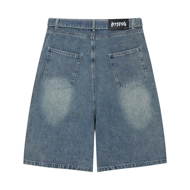 Back of light wash denim shorts with plain back pockets and logo waistband patch