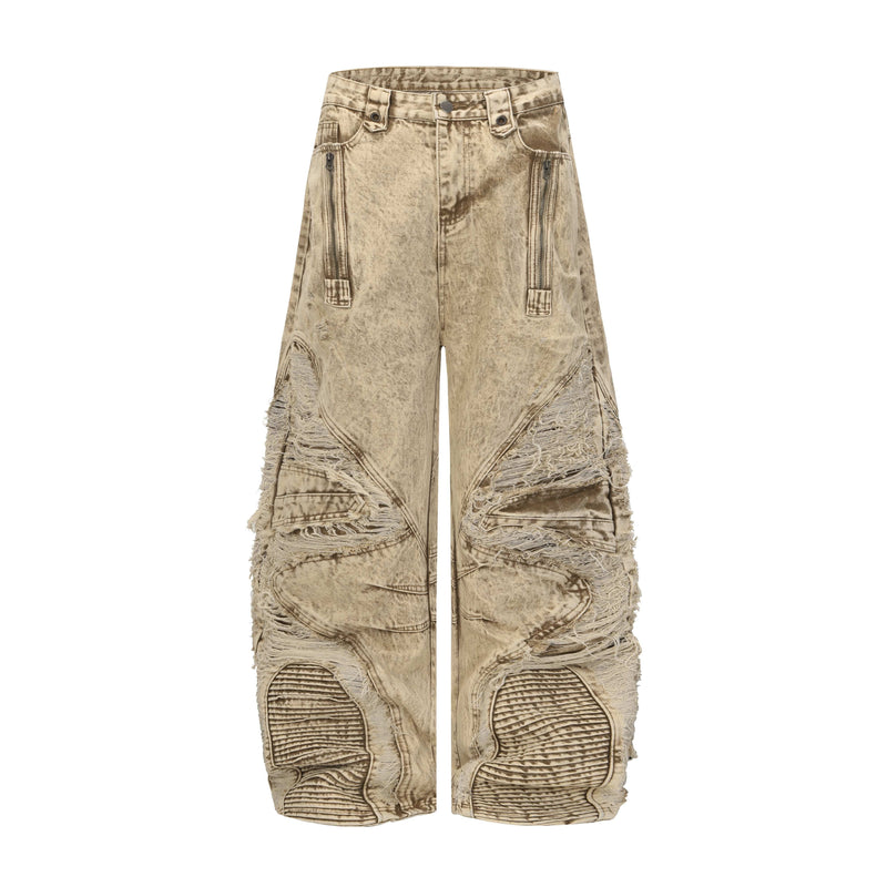 Front view of beige distressed wide-leg jeans with panel details and frayed knees