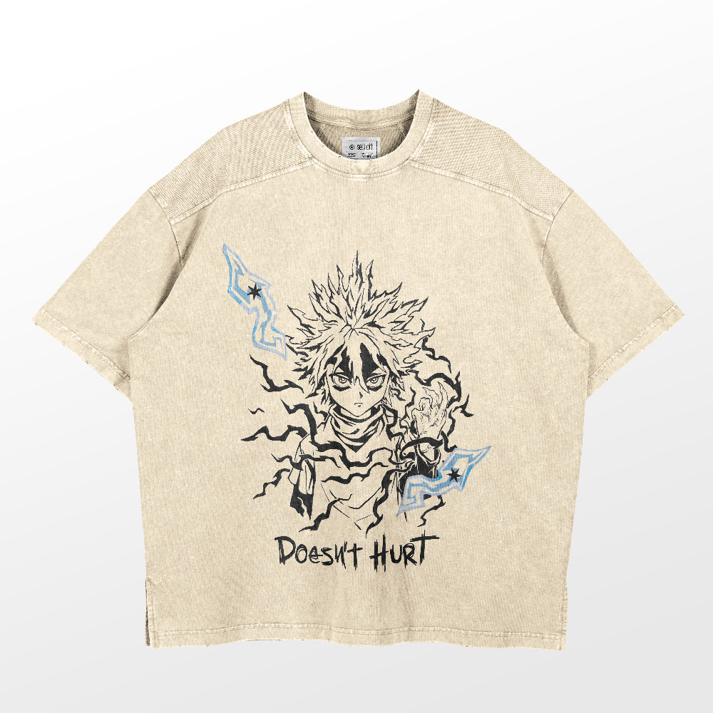 The Hunter × Hunter beige anime T-shirt features a spiky-haired character with electric effects in black and blue, complemented by "Doesn't Hurt" text. This washed vintage streetwear piece is crafted from 260 GSM high-quality cotton, seamlessly merging style and comfort.