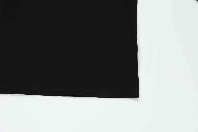 Black top lower hem detail with straight stitched edge