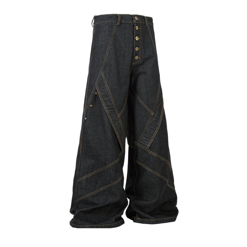 Angled front view of dark wide-leg denim pants with contrast stitching and button fly