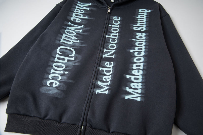 Black zip hoodie front close-up with blue gradient letter graphics and zipper