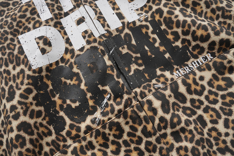Leopard print hoodie chest print close-up showing distressed black and white lettering