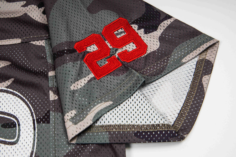 Camo mesh football jersey sleeve with red number 29 and oversized streetwear detailing