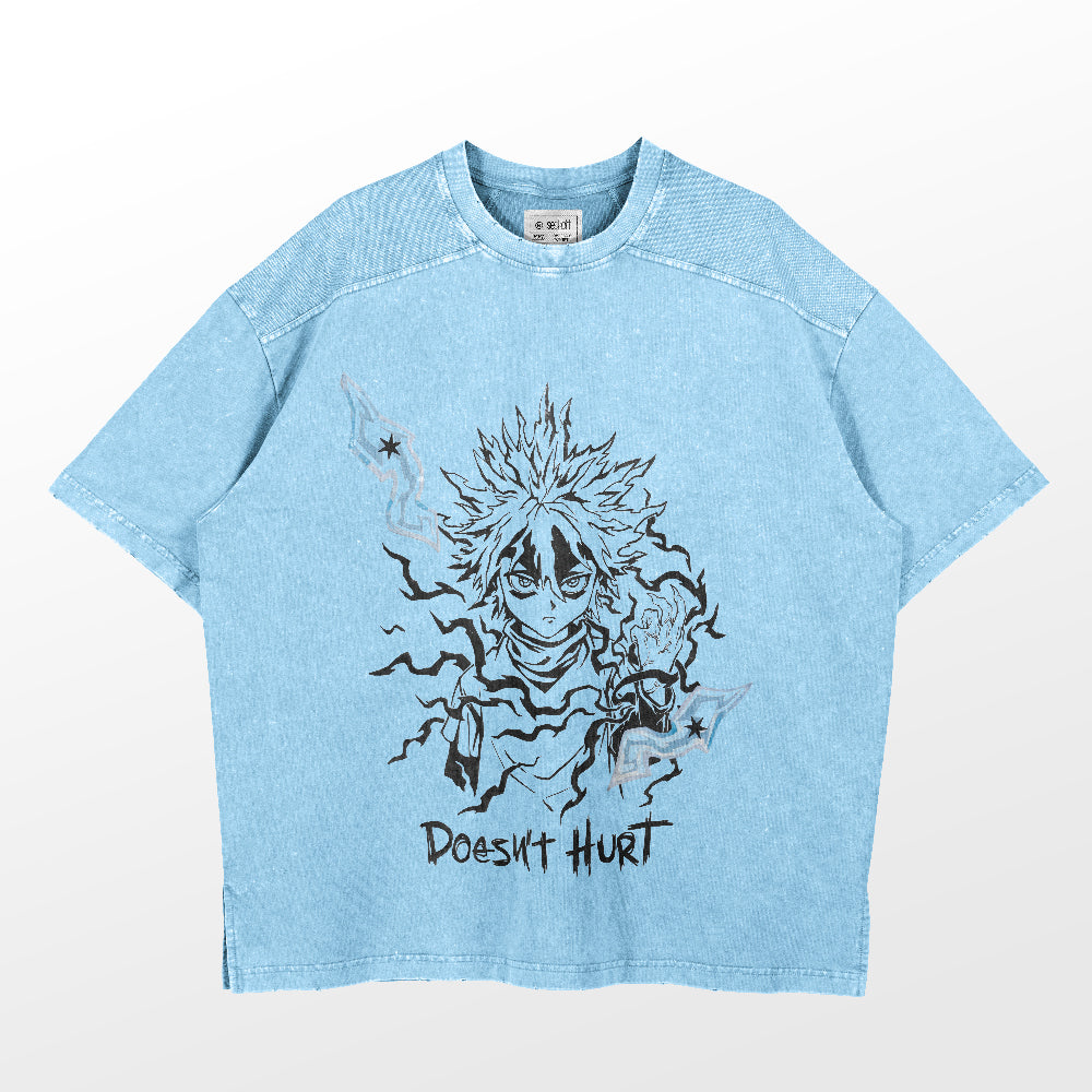 The Hunter × Hunter Anime Character 'Doesn't Hurt' T-shirt, made of 260 GSM high-quality cotton, displays a light blue vintage washed style with a short-sleeved design. It features a black and white graphic of a character with wild hair and energy lines, paired with the edgy text "Doesn't Hurt".
