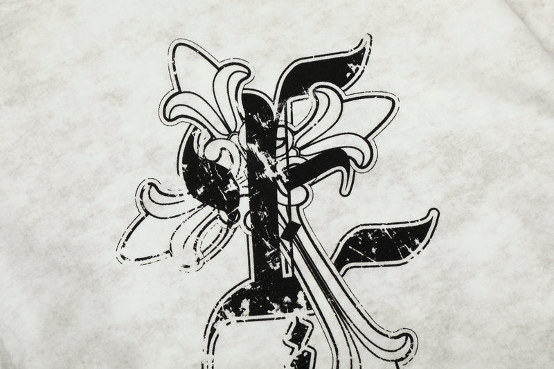Close-up of back graphic on white hoodie with layered black cross and floral-style design