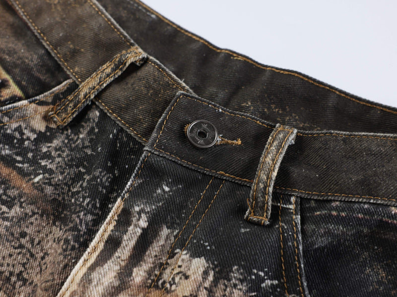 Close-up of waistband button and belt loop on animal print denim