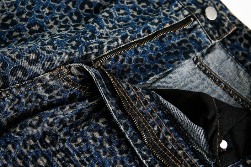 Close-up of blue leopard print jeans zipper and waistband detail