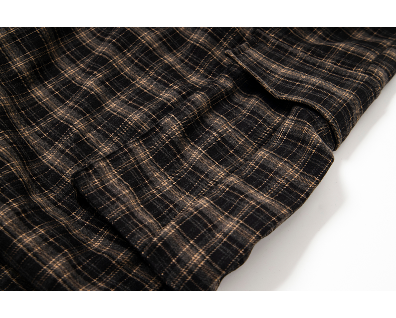 Close-up of plaid fabric and hem showing soft drape