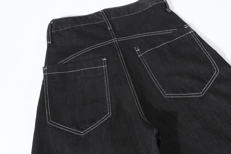 Back view of black denim pants showing wide legs and two patch pockets