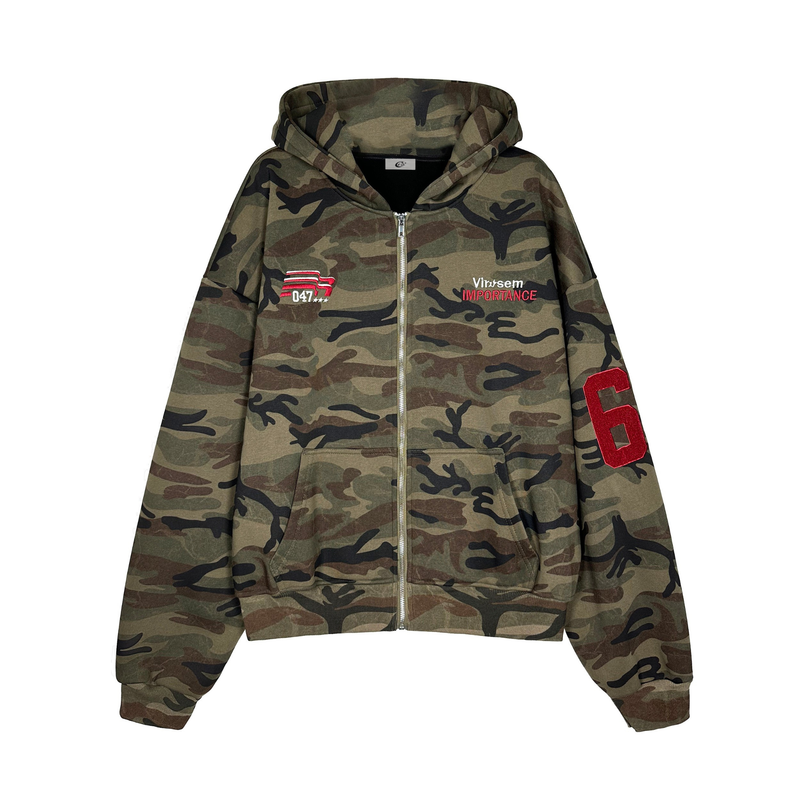 Front view of camo zip hoodie with hood up, chest embroidery, and pouch pockets