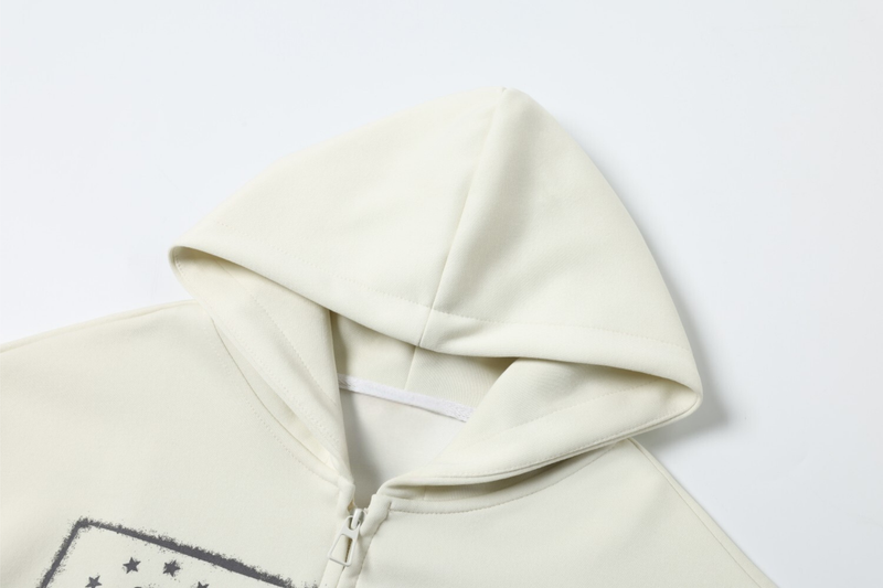 Cream hoodie hood close-up showing smooth fleece fabric and seam detail