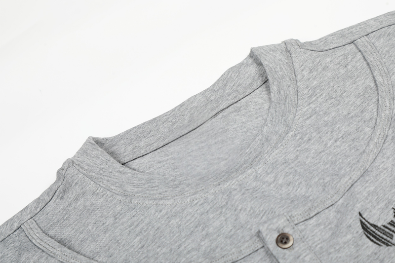 Gray tee shoulder and neckline close-up with topstitching