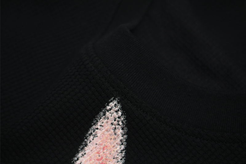 Black streetwear T-shirt with a glitch-style pixelated cat graphic on the chest