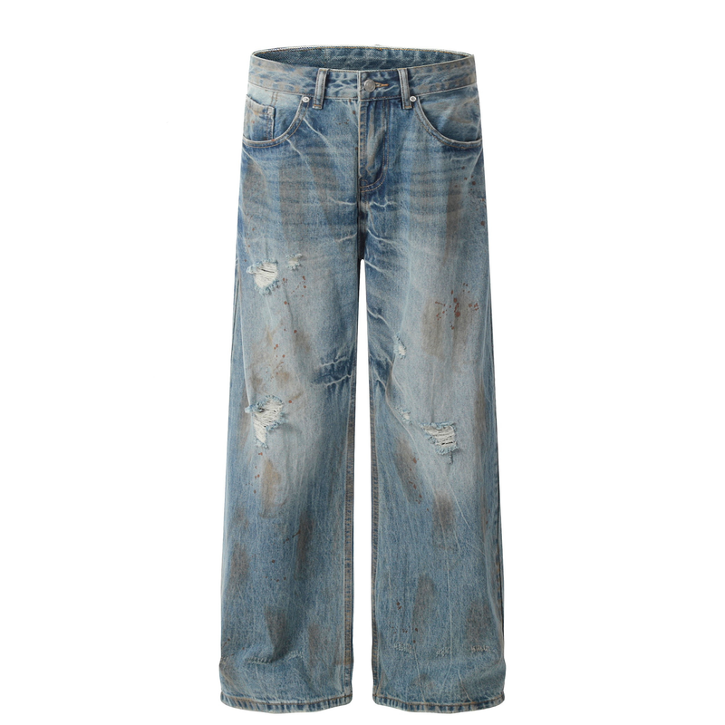 Front view of rust-wash wide-leg jeans with distressing, splatter marks, and five-pocket styling
