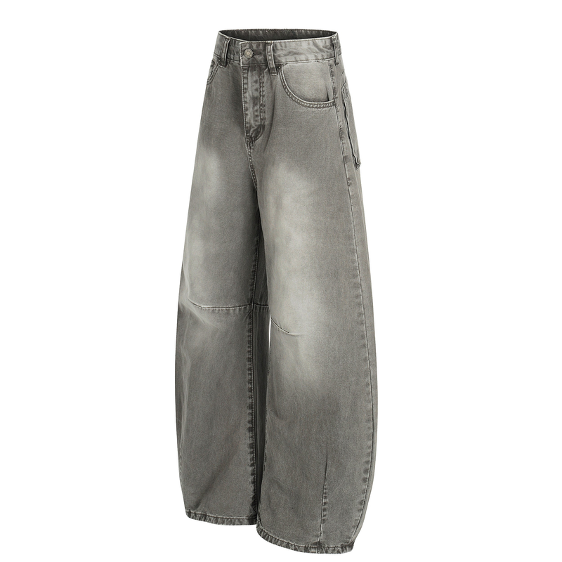 Angled front view of grey washed wide-leg denim jeans with curved leg shape and faded finish