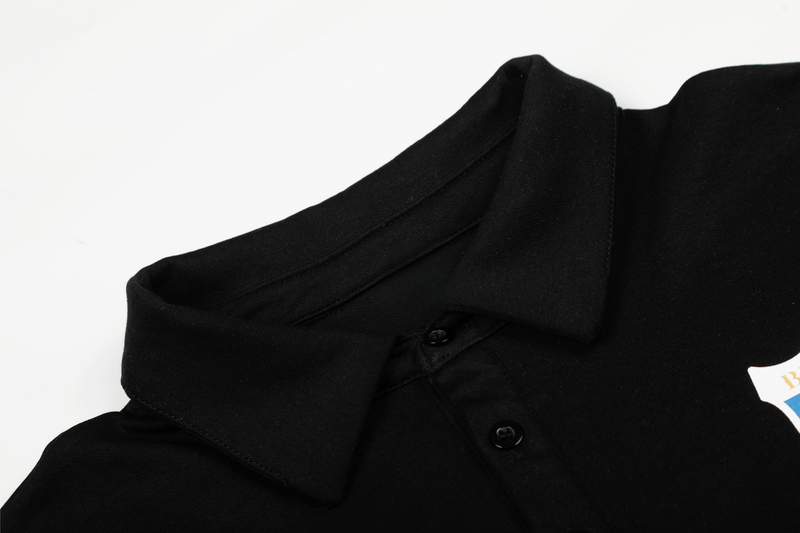 Close-up of black polo shirt collar and button placket