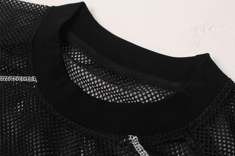 Black mesh jersey tee with ribbed crew neckline and white contrast stitching in a close-up streetwear detail shot