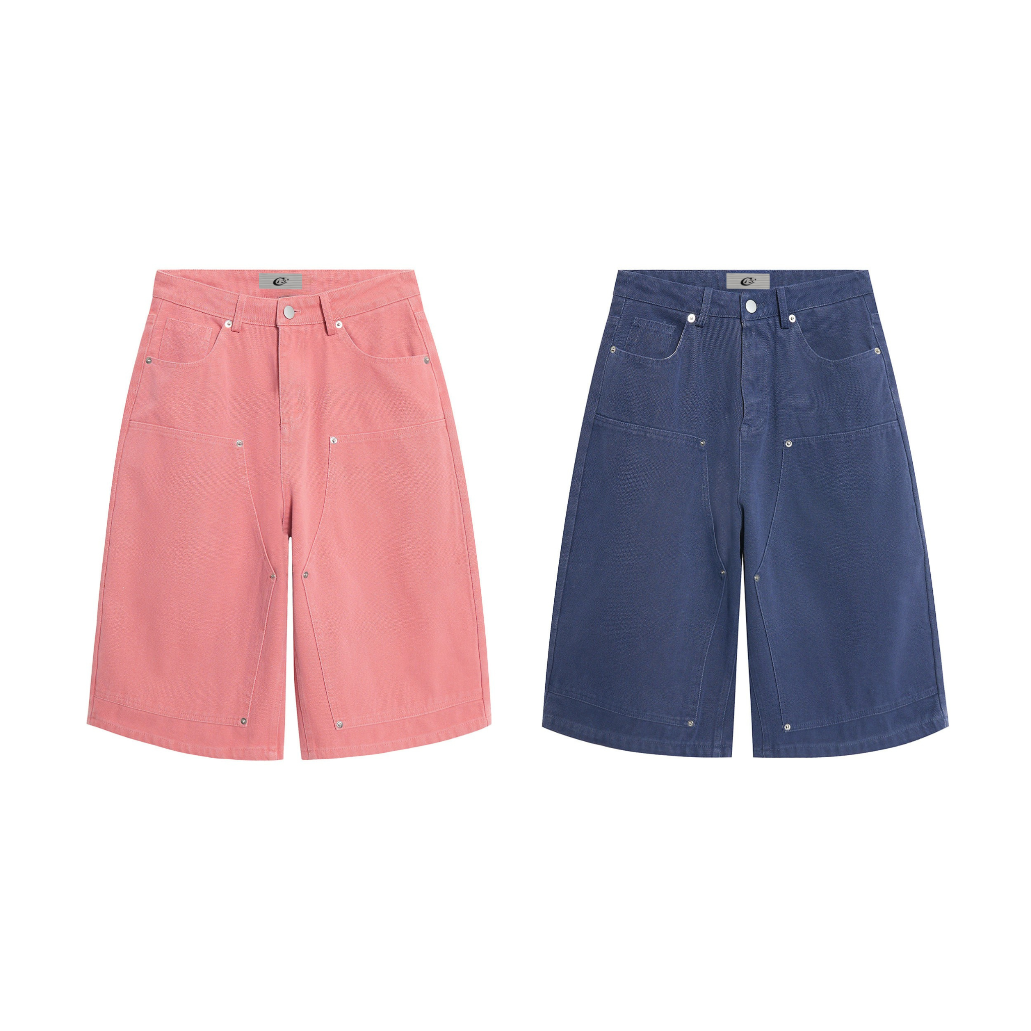 Omirad Vintage Canvas Jorts in washed pink and navy blue, wide-leg knee-length fit with metal rivet details, front view on wh