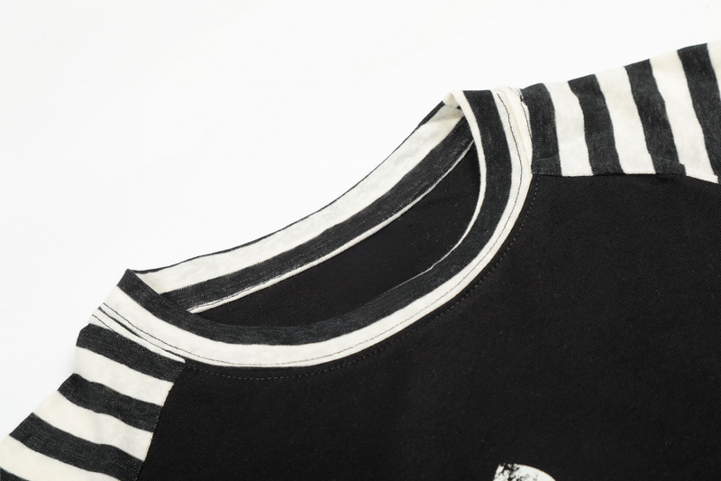 Striped ribbed crew neckline on black raglan long sleeve tee