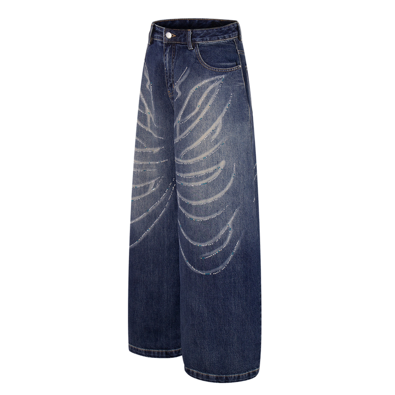 Angled front view of mid-blue wide-leg jeans with rhinestone wave detailing and coin pocket