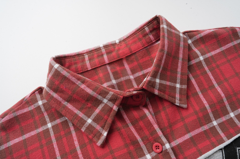 Close-up of red plaid flannel shirt collar with button placket and soft brushed texture