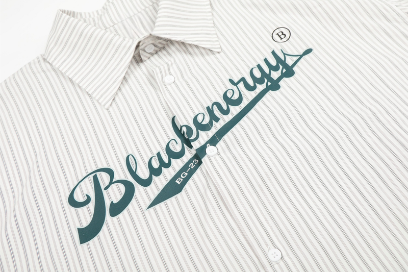 Close-up of Blackenergy graphic printed diagonally on cream striped shirt front