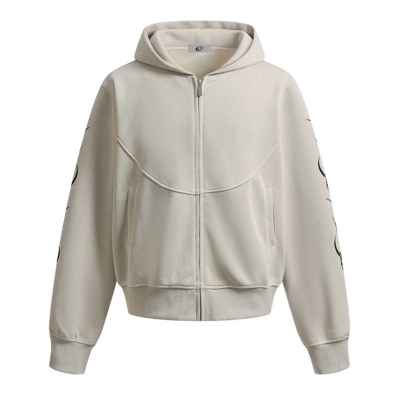 Beige zip-up hoodie front view with hood, kangaroo pockets, and black tribal sleeve graphics