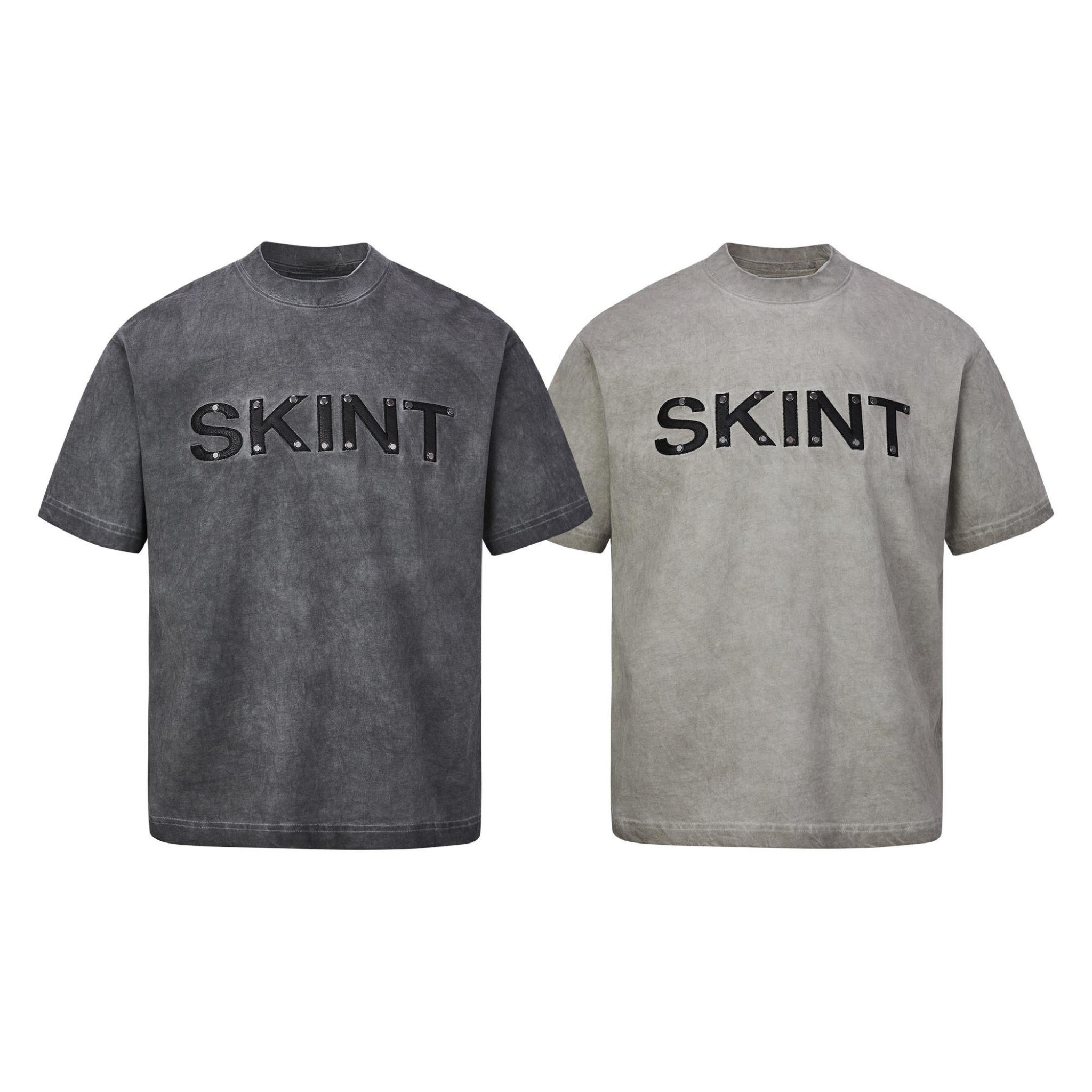 Omirad SKINT vintage washed heavyweight cotton tee in charcoal grey with raised black rivet lettering on the chest